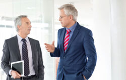 stock-photo-61369856-mature-business-men-discussing-work-in-office